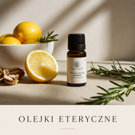 Olejek eteryczny cytrynowy w butelce z cytryną i gałązkami rozmarynu